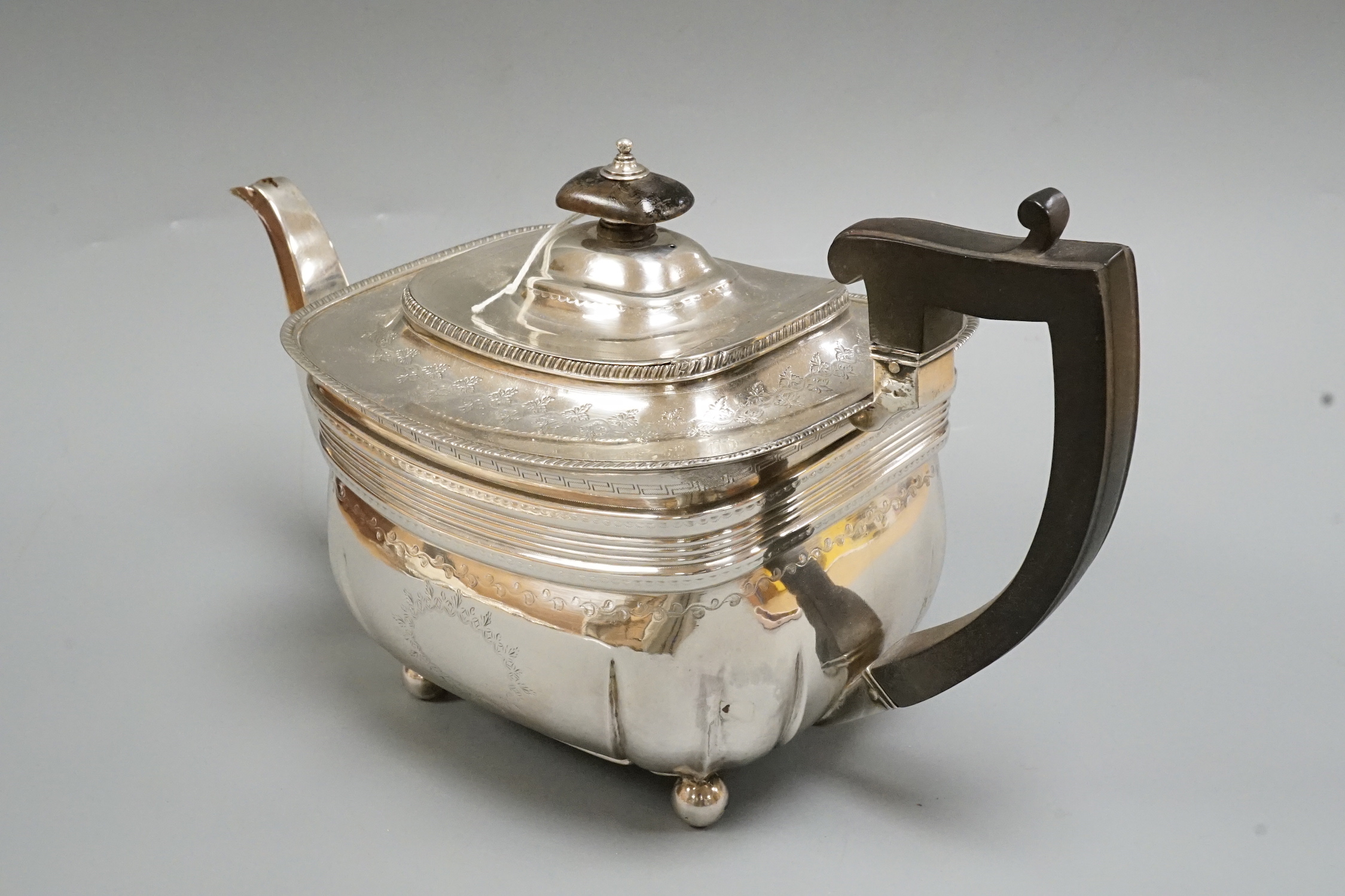 A George III chased silver teapot, by Peter & William Bateman, London, 1811, gross weight 20.1oz.